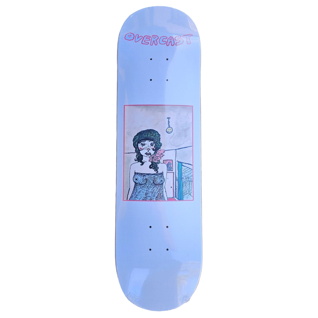 Skateboard deck with a graphic design of a woman and the brand 'Overcast' on a light blue background.