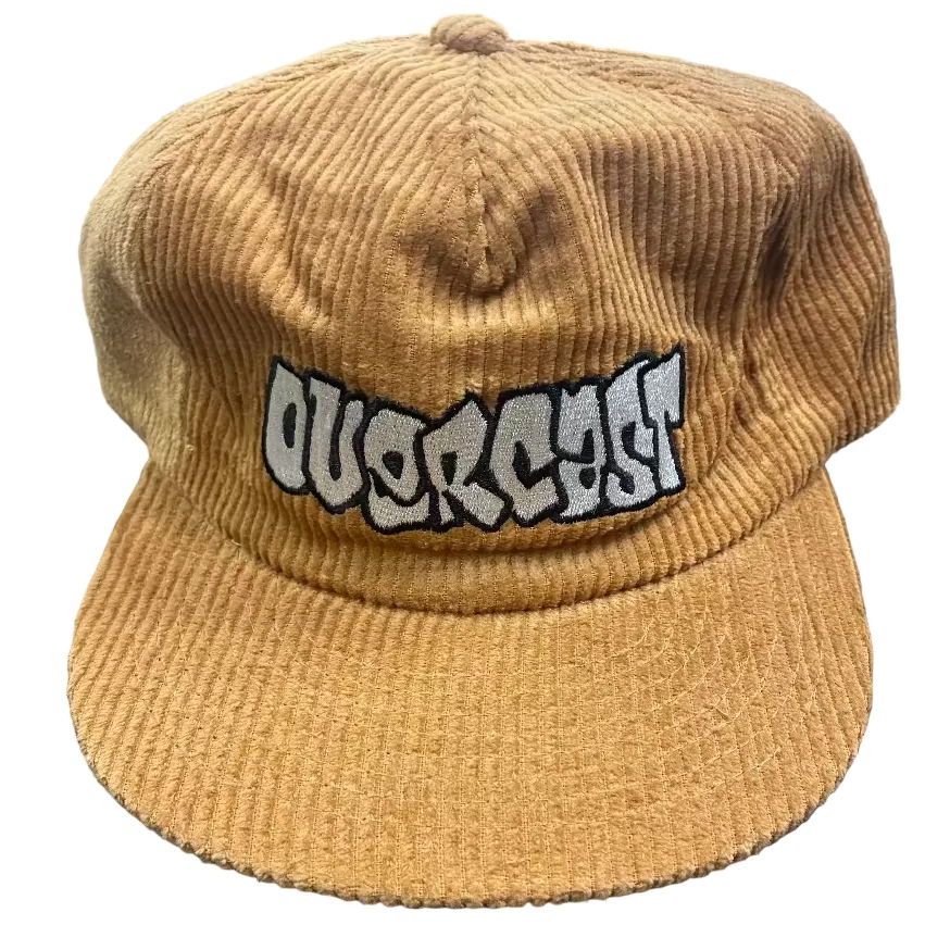 Brown corduroy cap with 'Duckcast' logo on a dark textured surface