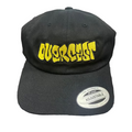 Black cap with yellow text 'OVERCAST' on a textured surface