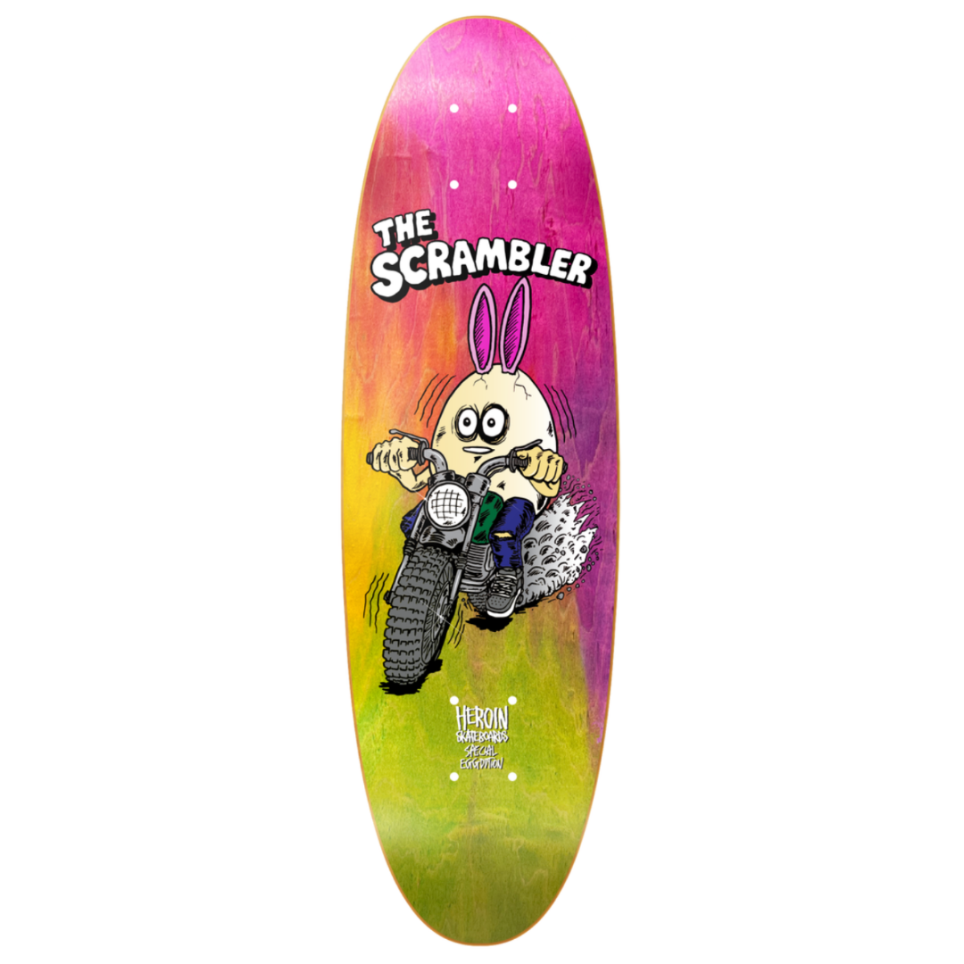 Skateboard deck with a cartoon character and 'The Scrambler' text on a colorful background