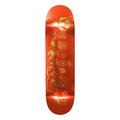 A skateboard deck shown vertically against a plain white background, featuring a glossy red-orange finish with a stylized yellow and green graphic pattern printed down the center.