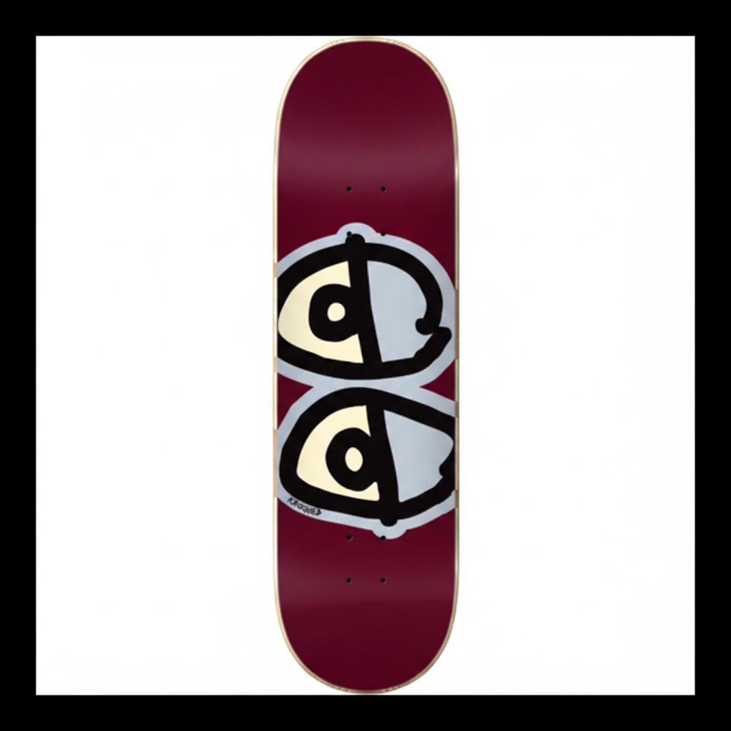 A skateboard deck with a deep burgundy base featuring a graphic of two stylized eyes split vertically in black, cream, and gray.