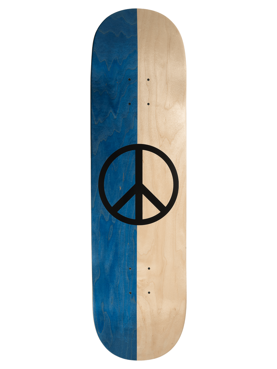 A skateboard deck with a vertical split design, featuring a dark blue wood-grain finish on the left and a natural light wood-grain finish on the right, with a large black peace symbol printed in the center.