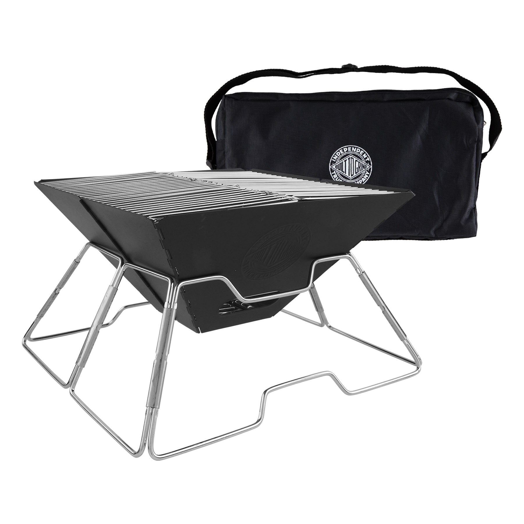 A black folding camp grill with a silver metal frame, shown with its black carrying bag behind it on a white background. The bag features a circular logo 